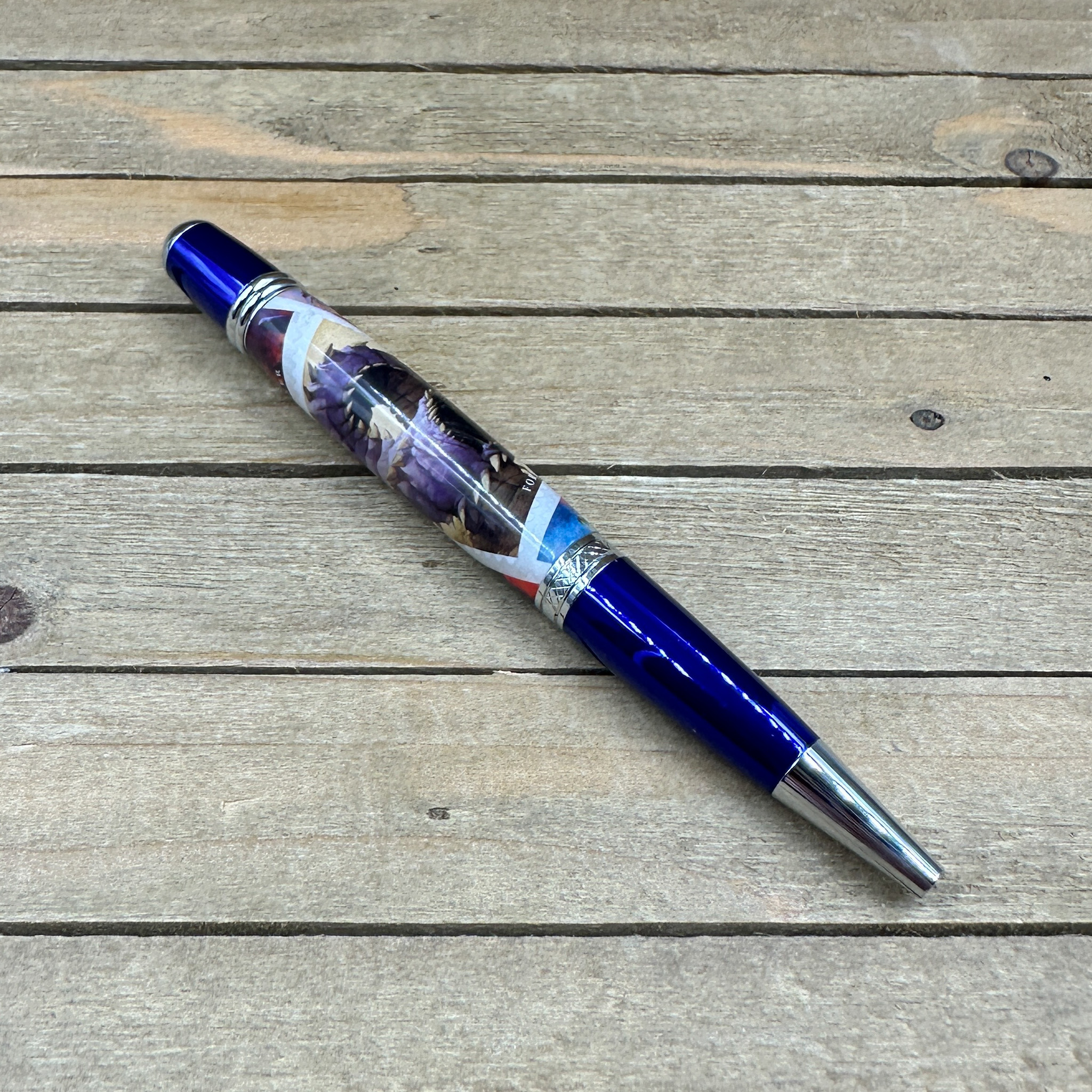 Blue and chrome pen woth DnD postage stamps cast in clear resin  Blue and chrome pen woth DnD postage stamps cast in clear resin
